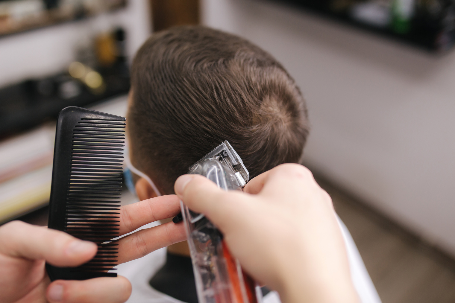 Barber Cutting Hair of Customer